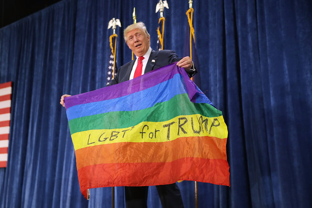 GREELEY, CO - OCTOBER 30:  Republican presidential nominee Donald Trump holds a rainbow flag given to him by supporter Max Nowak during a campaign rally at the Bank of Colorado Arena on the campus of University of Northern Colorado October 30, 2016 in Greeley, Colorado. With less than nine days until Americans go to the polls, Trump is campaigning in Nevada, New Mexico and Colorado.  (Photo by Chip Somodevilla/Getty Images)