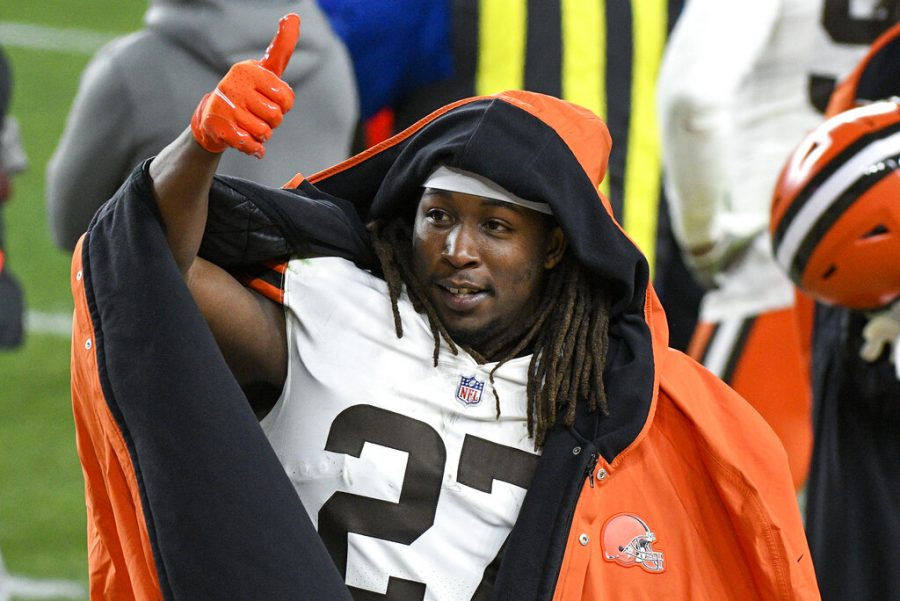 Cleveland Browns running back Kareem Hunt (27) celebrates on the sideline during the first half of an NFL wild-card playoff football game against the Pittsburgh Steelers in Pittsburgh, Sunday, Jan. 10, 2021. (AP Photo/Don Wright)