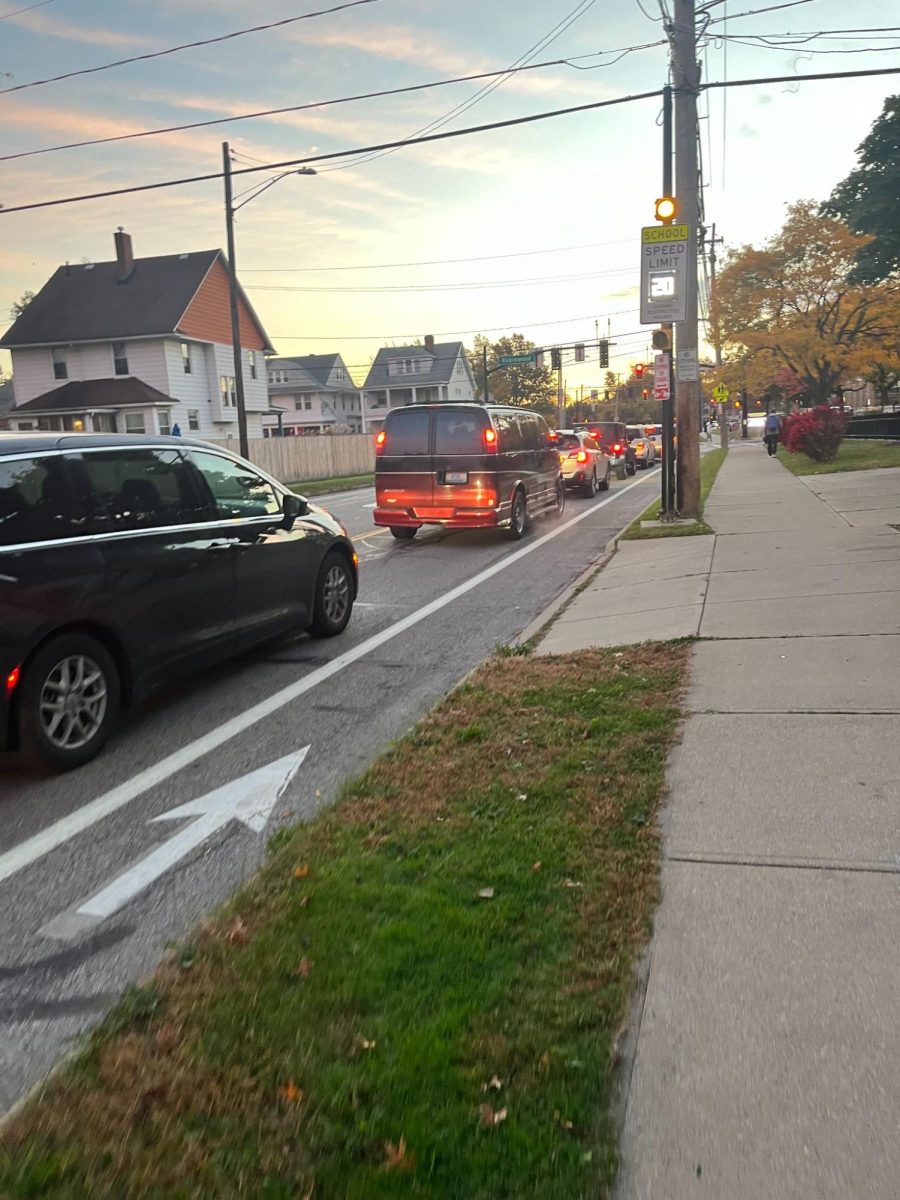 Lakewood High students waiting at the red light to enter the school's grounds
