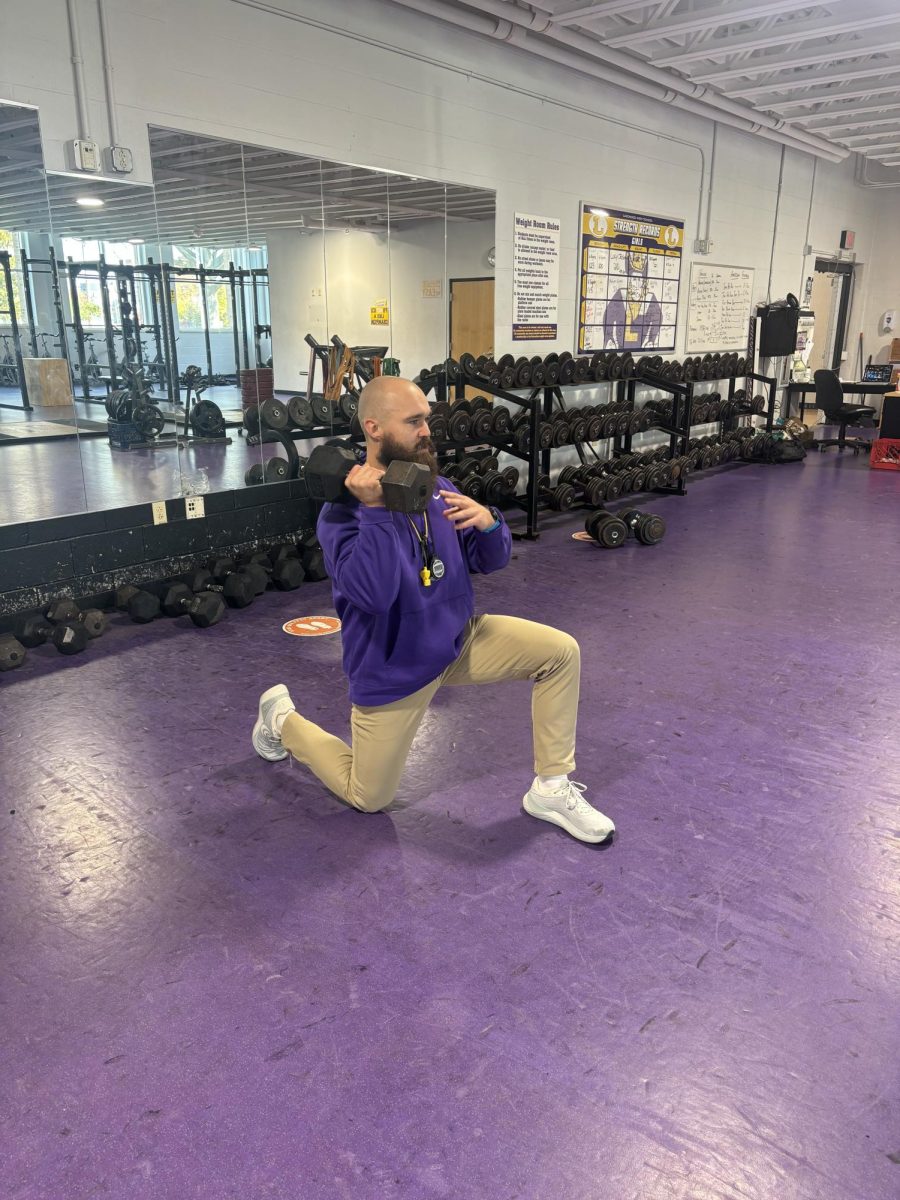 Coach Jimmy Gajewski demonstrating correct lifting technique.