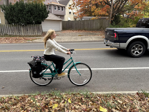 
Student Clover Griggs joyously rides her bike to school, 
ready for the day to come
