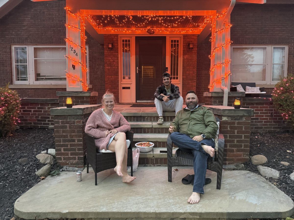 Neighbors gather together to greet trick-or-treaters. (Colleen Schroeder, Charbel Nakhle, and Neil Schroeder)