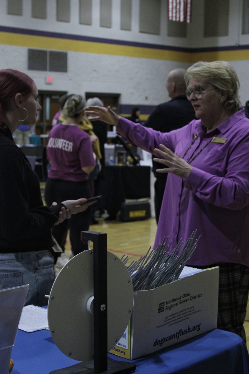 Members of the Lakewood community laughing together at Garfield Middle School for the ‘Welcome to Lakewood’ event. 