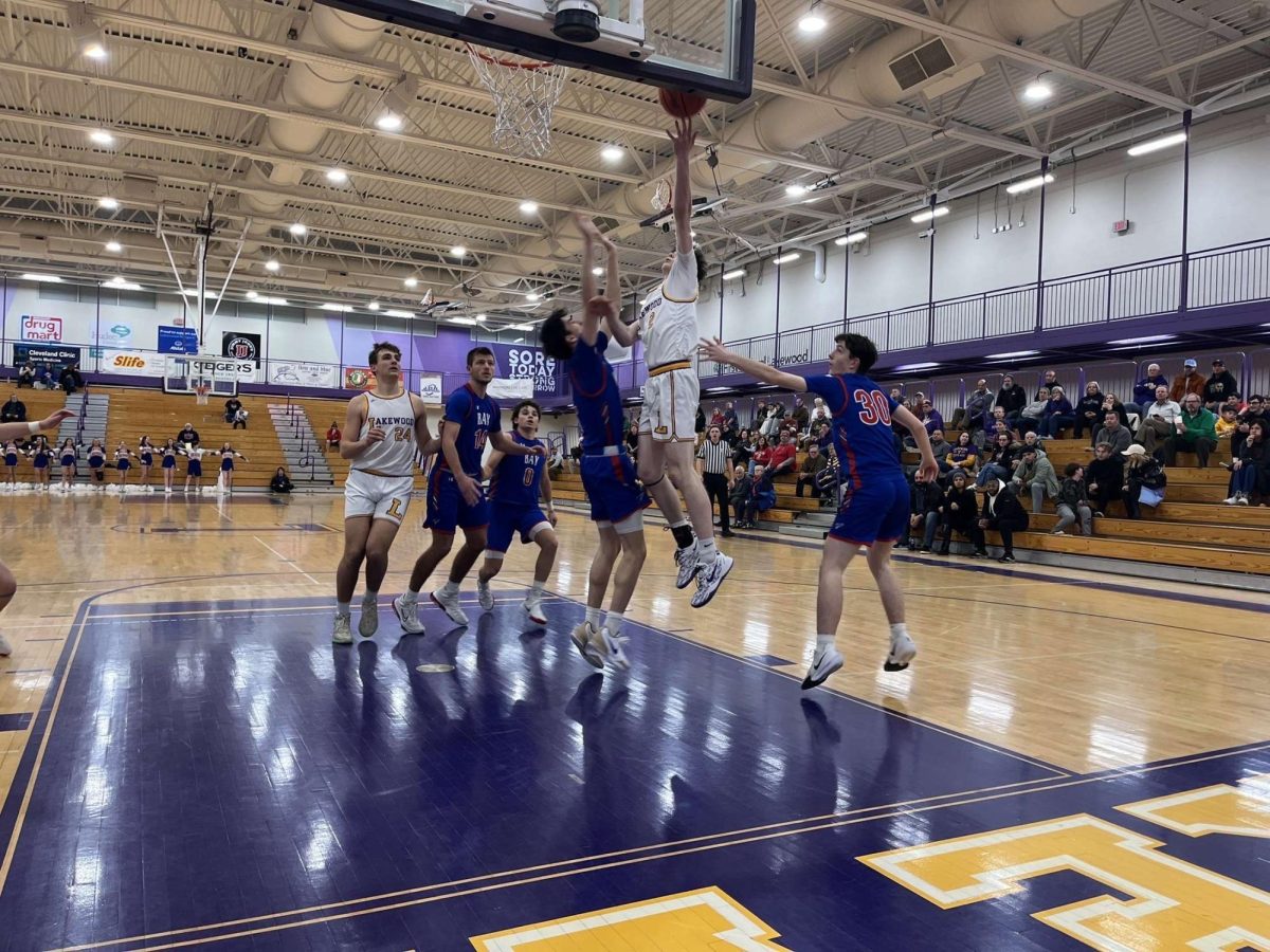 Senior Lucas Seguine jumps to make a shot, scoring for the Rangers.