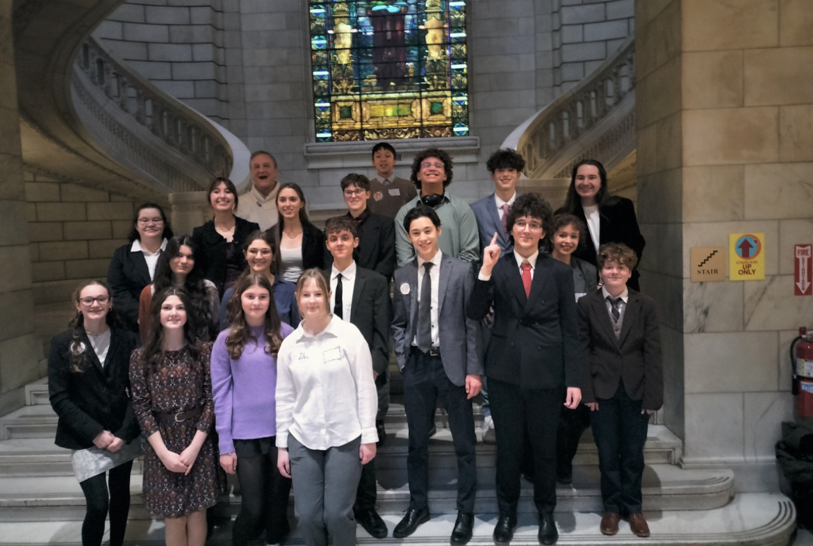 Group photo of Mock Trial members at the Justice Center the day of competition.