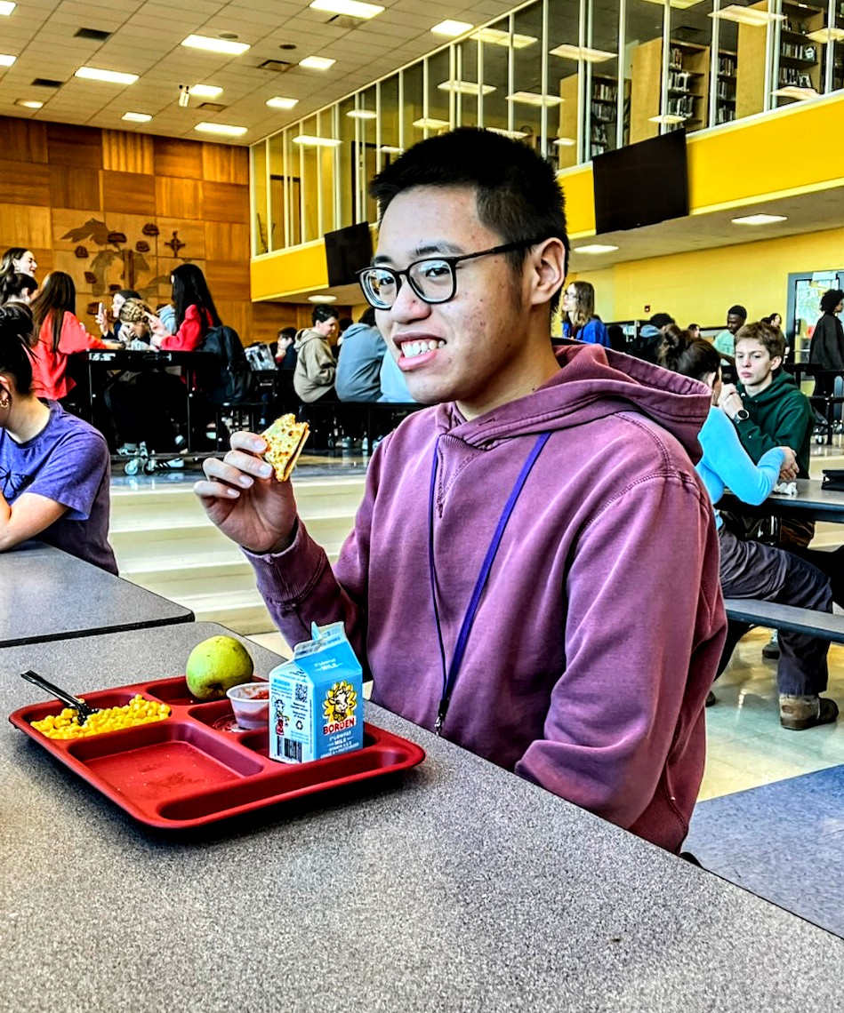 Savoring every bite, student Kenny Cung fueling up for the rest of the day.