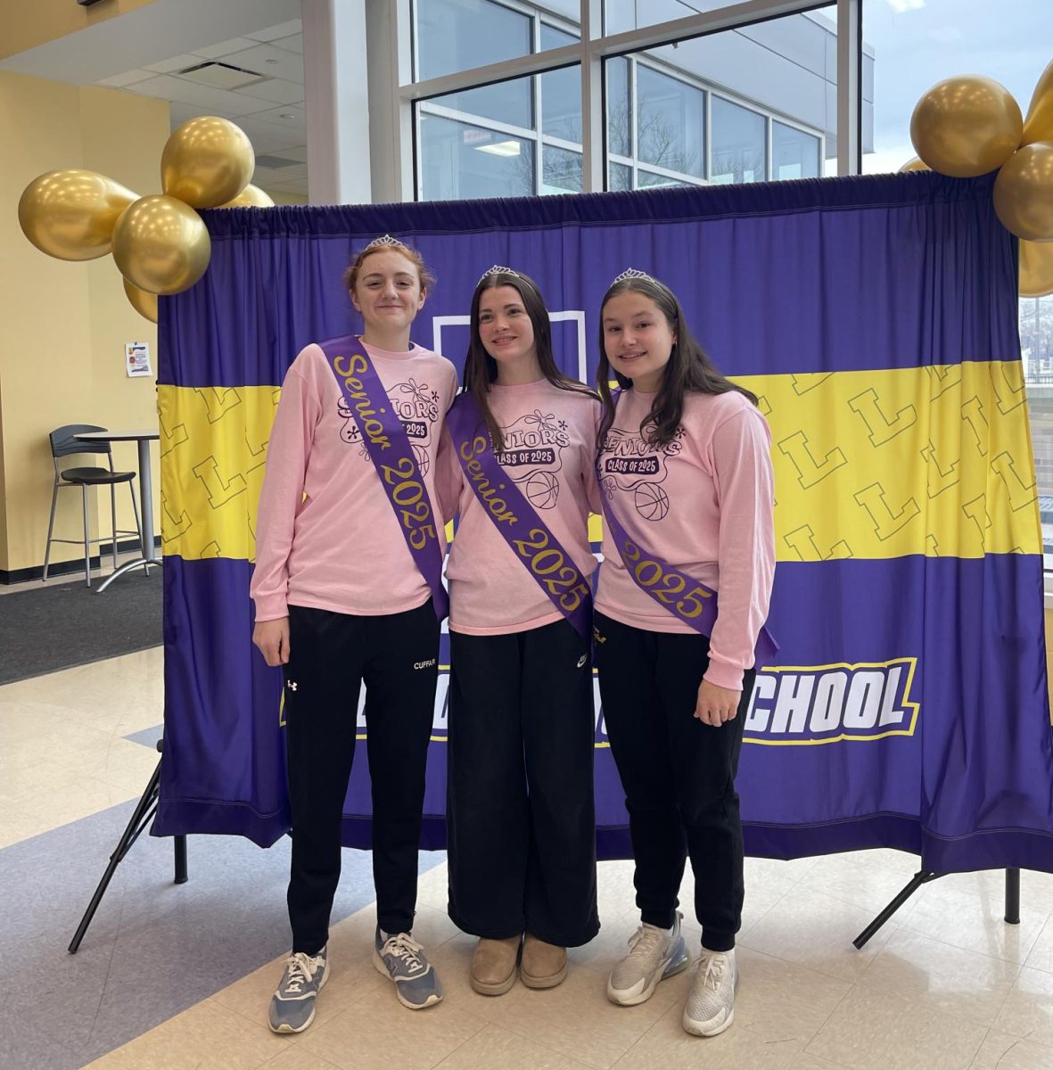 The Ranger girls' basketball team's three seniors Ava Cuffari, Elizabeth Doup, and Madison Comer stand together for a photo in celebration of their senior night on Saturday, February 8th.