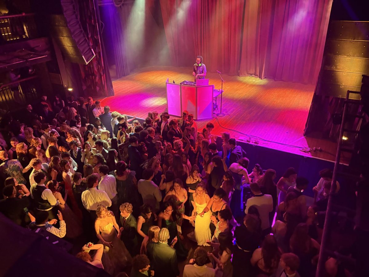 Students gather on the dance floor, ready to dance the night away.