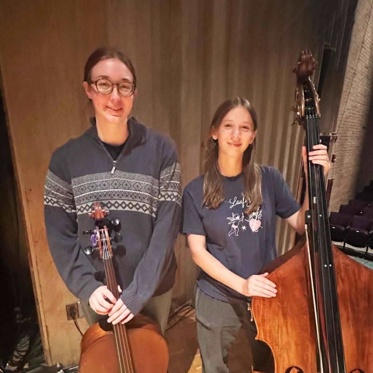 Nora Dunne with her cello on the left, Abby Kovach on the right.