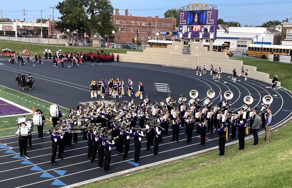 Janke and Kerney warming up the band for their halftime performance.