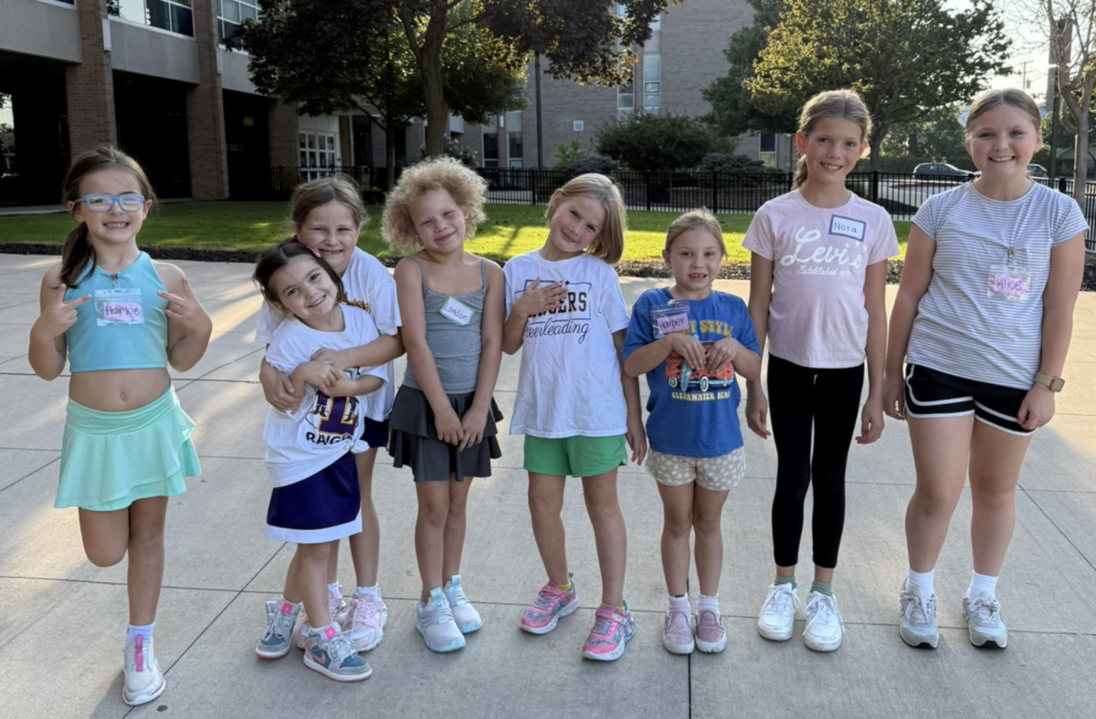 Campers Nora, Evelyn, Scarlett, Harper, Alice, London, Frankie and Graciana flashing big smiles and loving camp.