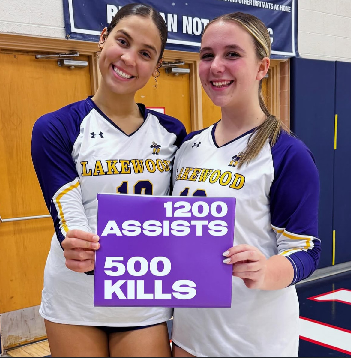 Senior Erin Boyer and sophomore Ariana Hueter celebrate breaking their individual records.