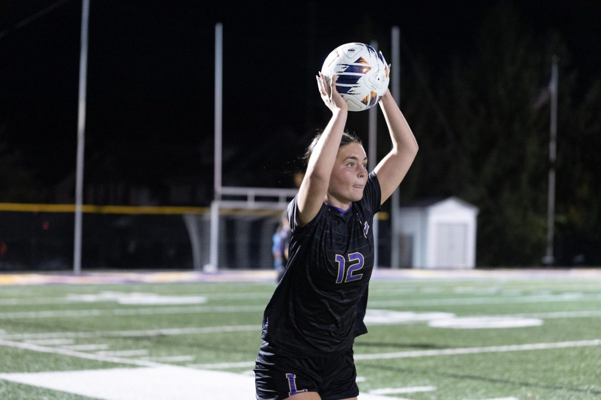 Tessa throws the ball in.