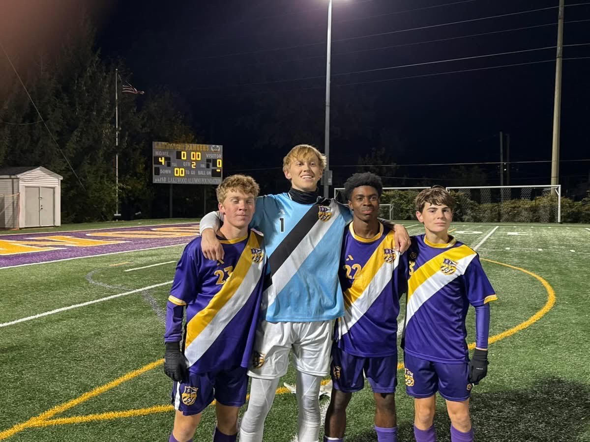 The match's scorers pose with their rock-solid goalkeeper.