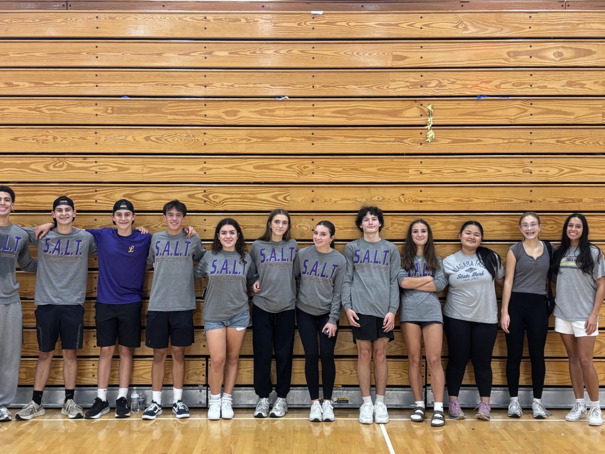 Students line up after an evening full of playing with the kids (Right to Left: Nyle Donaldson, Graham McAlvey, Carter McAlvey, Caden Sandoval, Riley Swift, Lilly Boland, Ruby McEwen, Liam Dowell, Delaney Rodgers, Vashti Arrow, Lyla Parkison, Sophia Eccher)