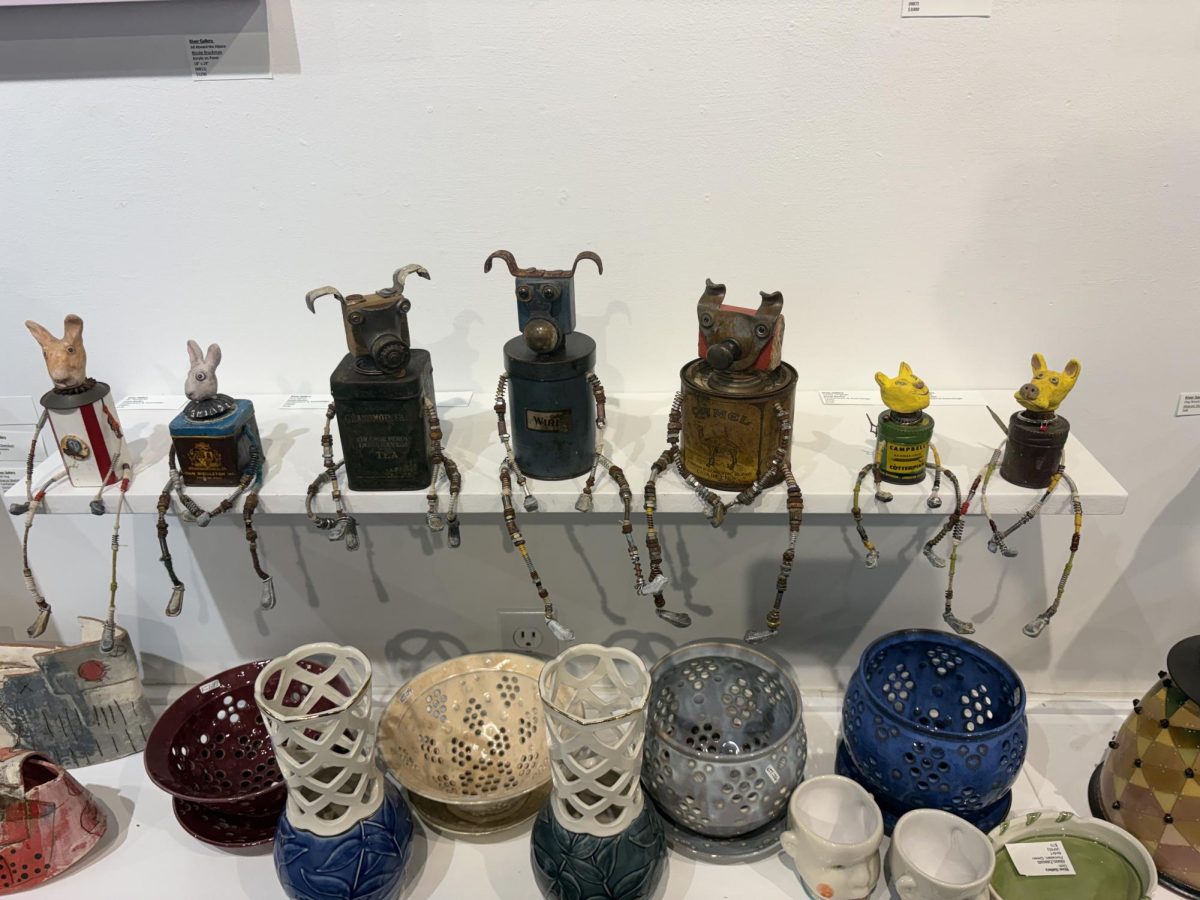 Scrap art of animals sitting on a ledge