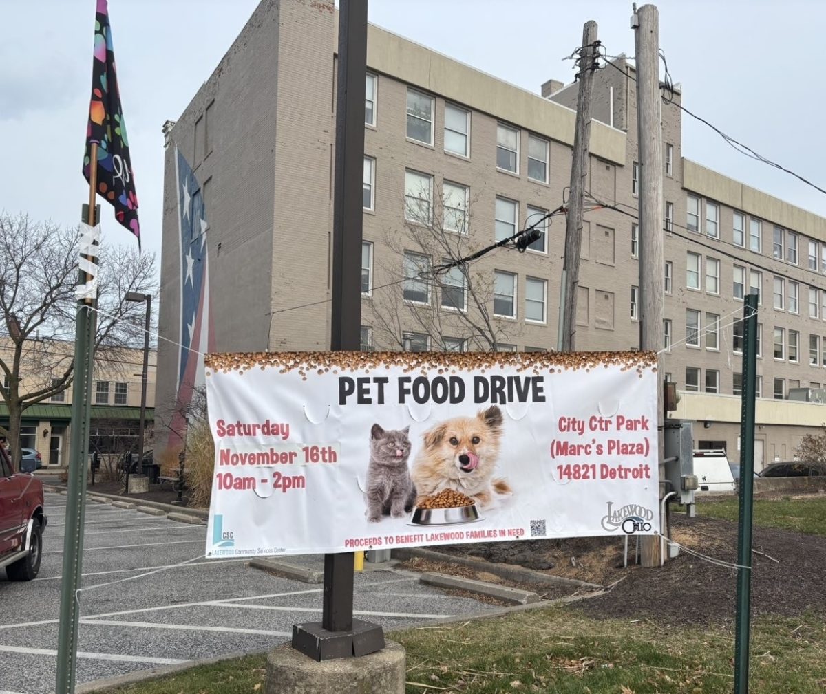 An advertising banner hangs next to the food collection booth in Marc’s Plaza.