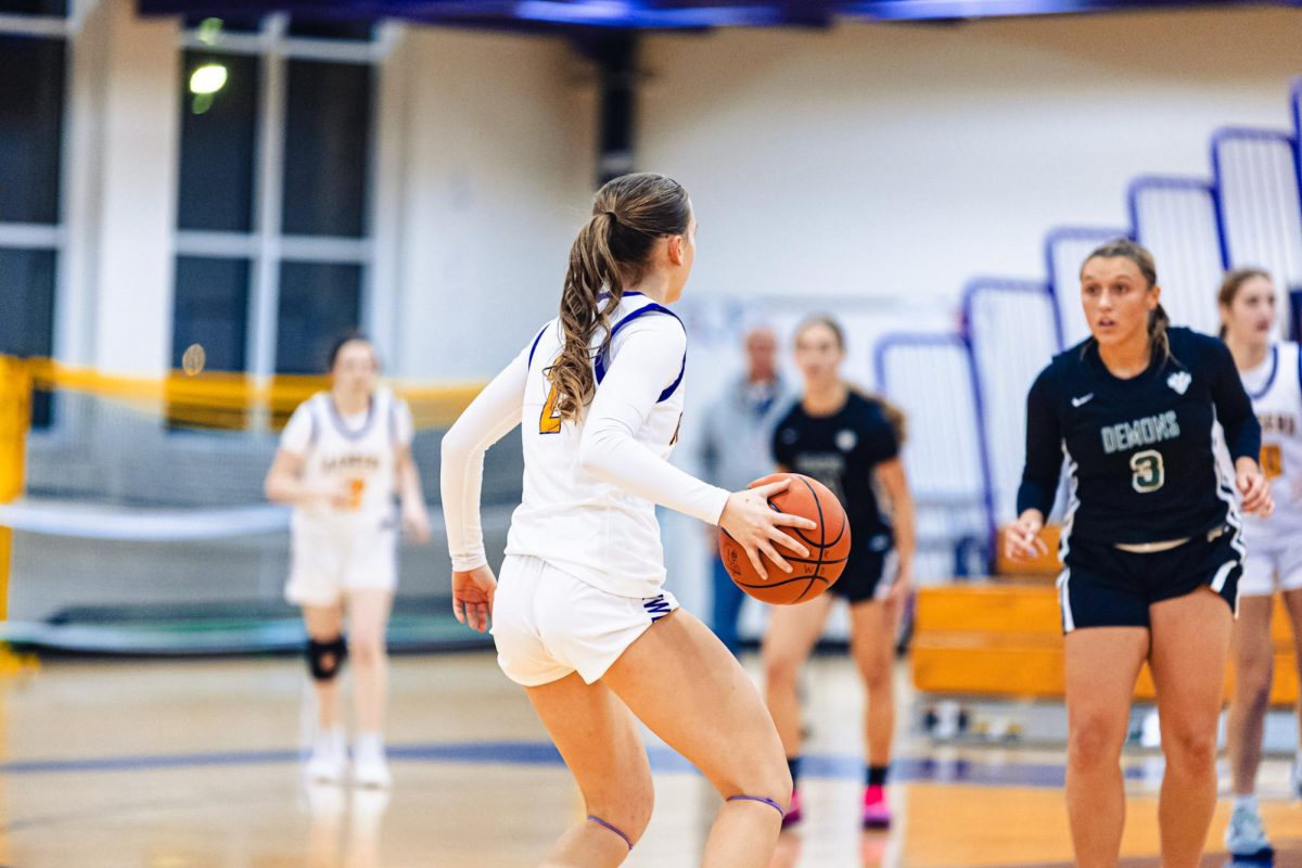 Olivia brings the ball up court. 