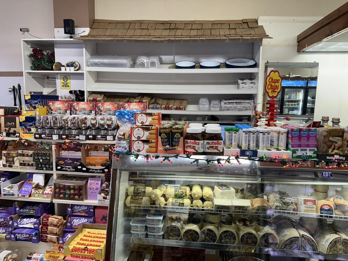 At the front counter, there is a selection of fresh-cut meats, candies, sandwich spreads, and on-the-go snacks.
