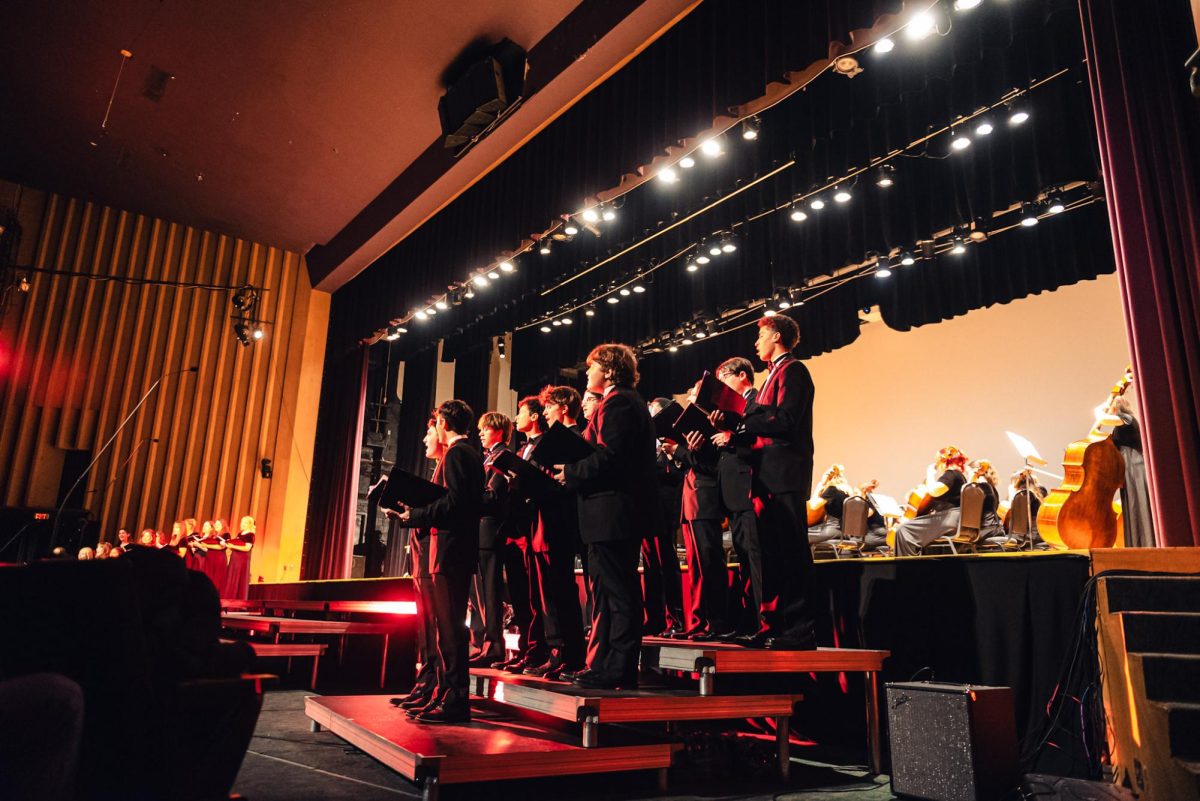 Mixed choir performing in the Sounds of the Season concert.