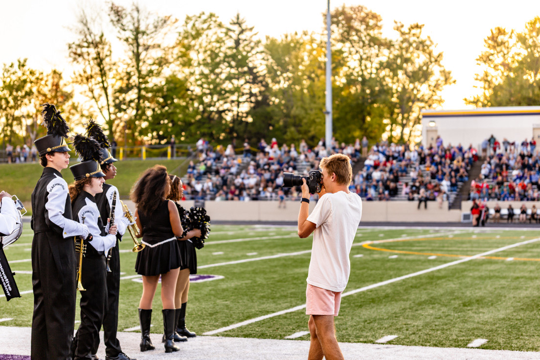 Babson in action on the sidelines of Lakewood Football's Friday night under the lights.