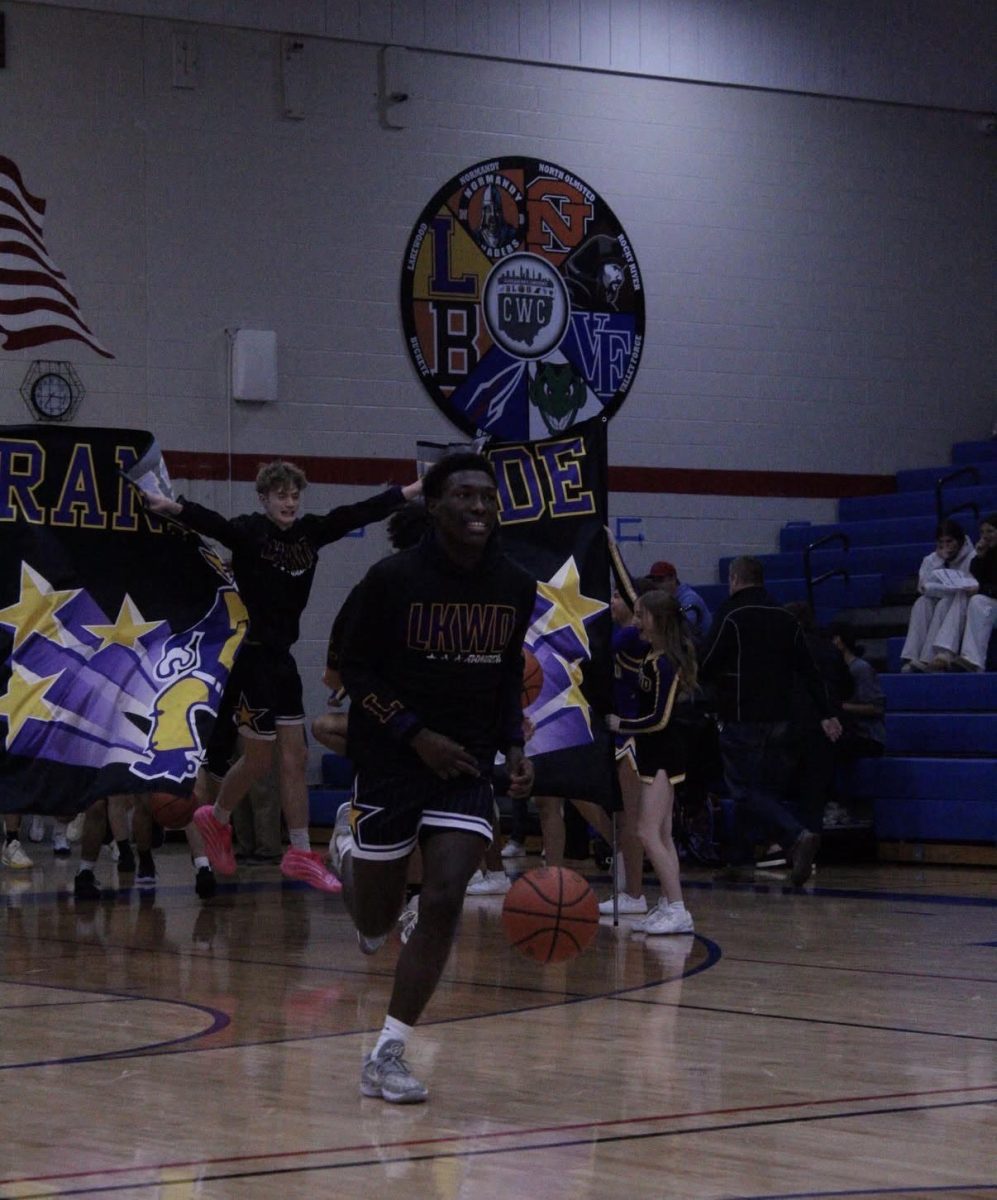 The varsity team running on to the court.
