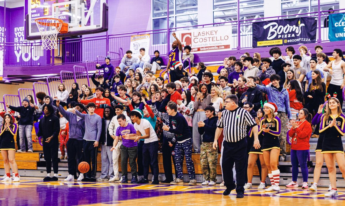 The student section cheering for the boys' basketball team Friday, Dec. 12, against Buckeye.