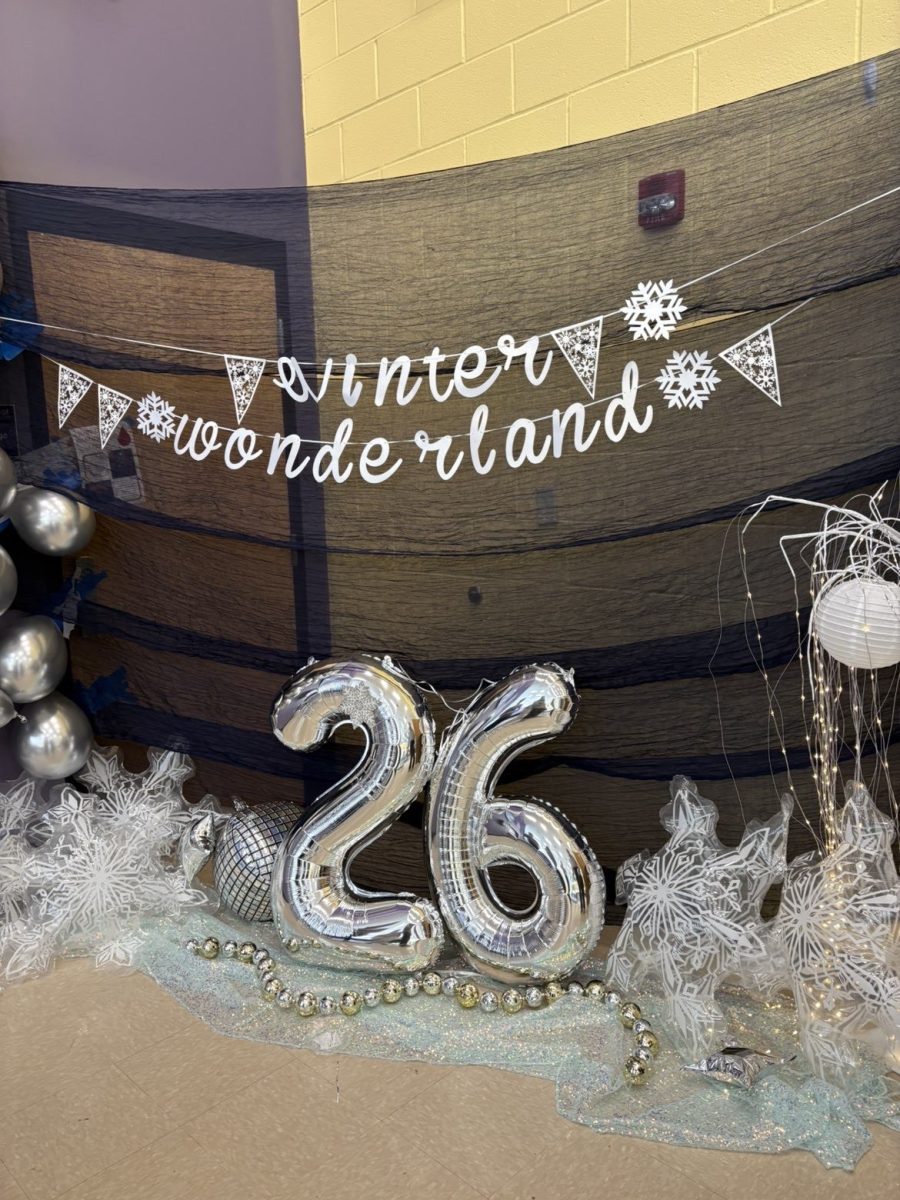 Winter-themed decorations welcome students outside the gym for the Snowball dance.