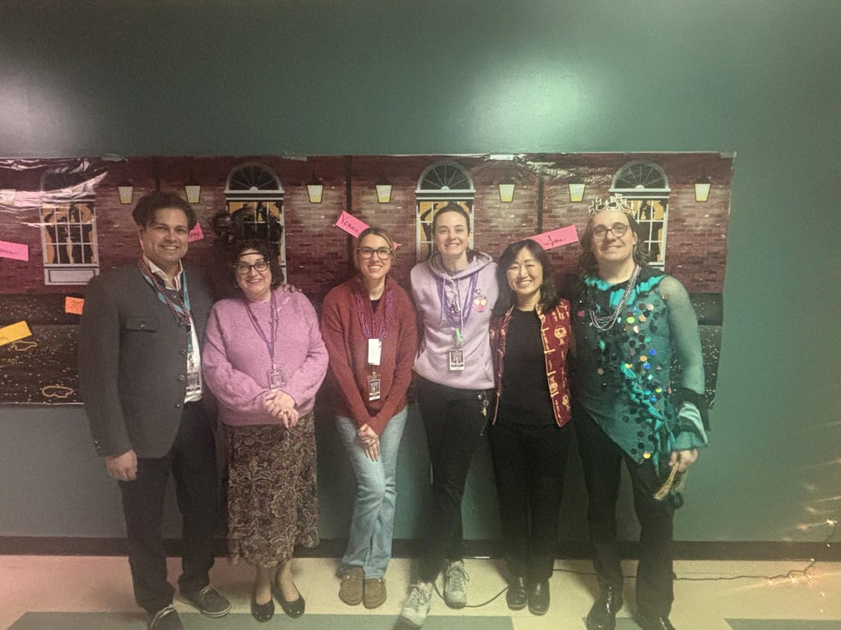 The language teachers pose together. (Left to right: Gregory Sent, Katherine Braquet, Leah Strejcek, Erin Costello, Piwen Ku, Matt Heslep)