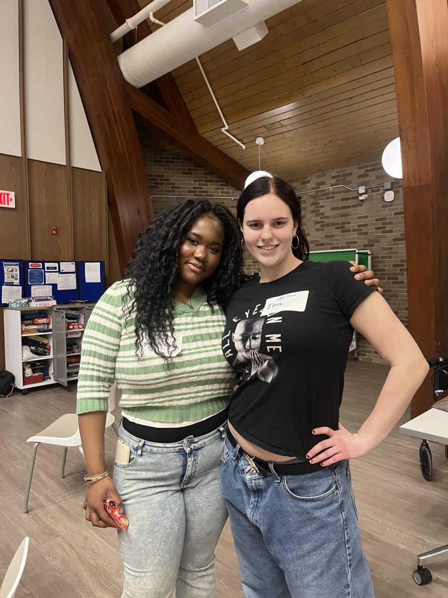 Junior Shontavia Newson and Freshman Isabella Stewart volunteering at the event