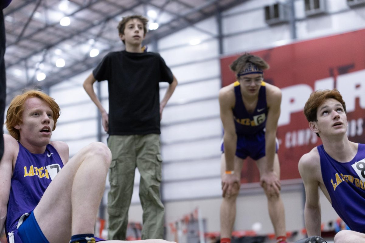 The boys 800m runners regroup after their race.
