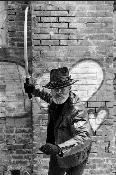 Parker poses with a samurai sword.