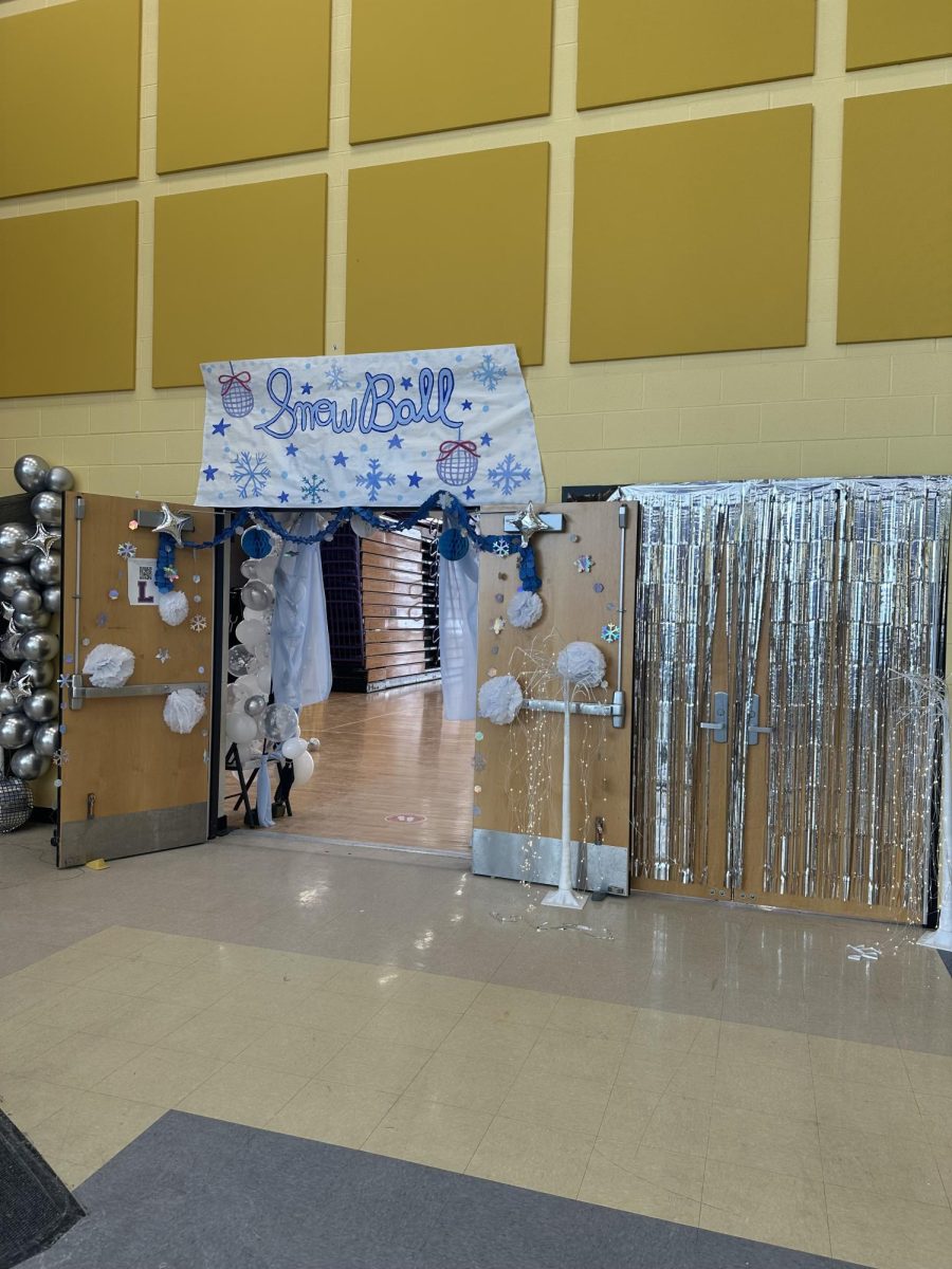 Student Council decorates for Winter Formal with a snowball theme.