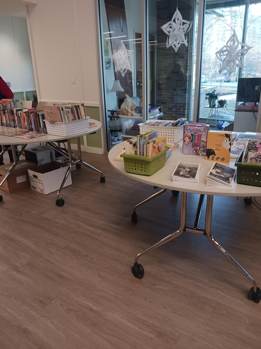 Tables of children's books at Cove Community Center