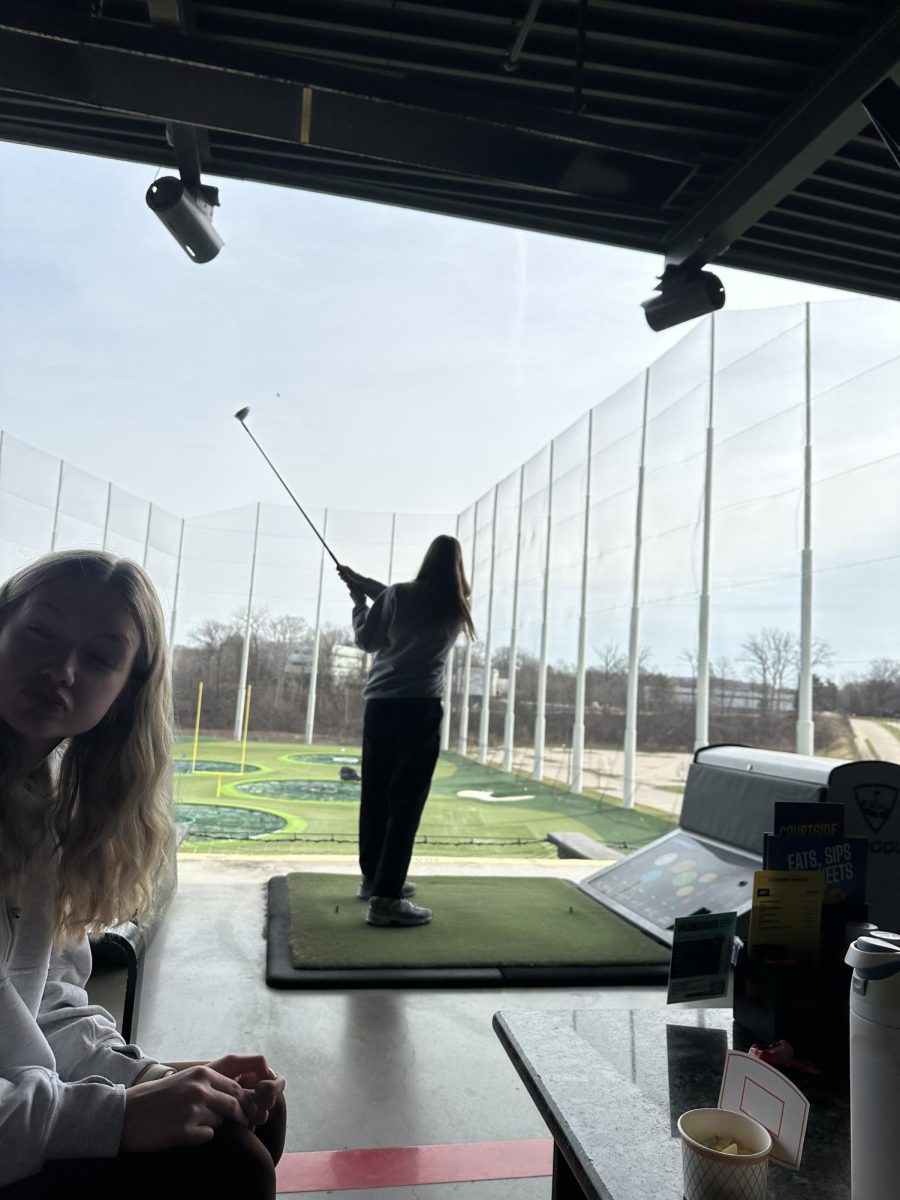Freshman Chloe Carroll taking a swing at TopGolf.