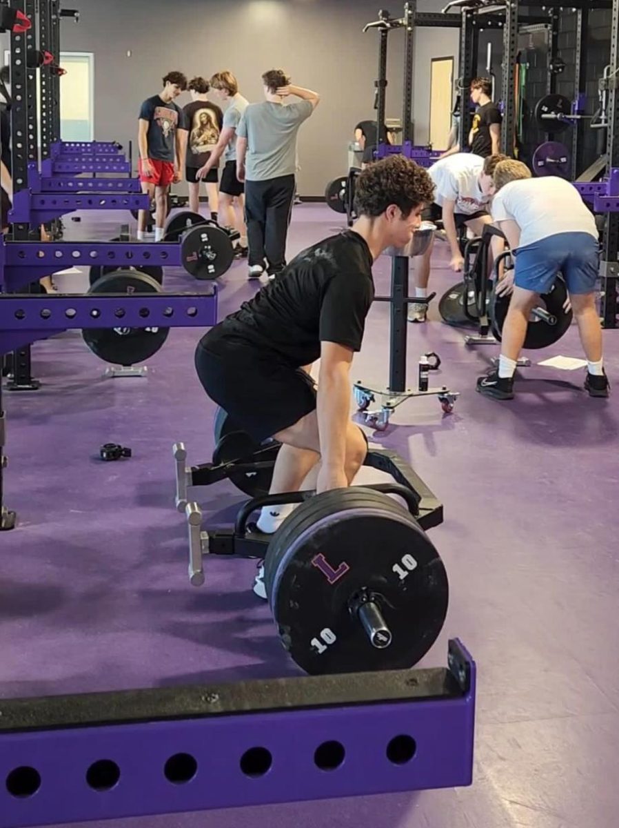 The baseball team working hard in the LHS weight room.