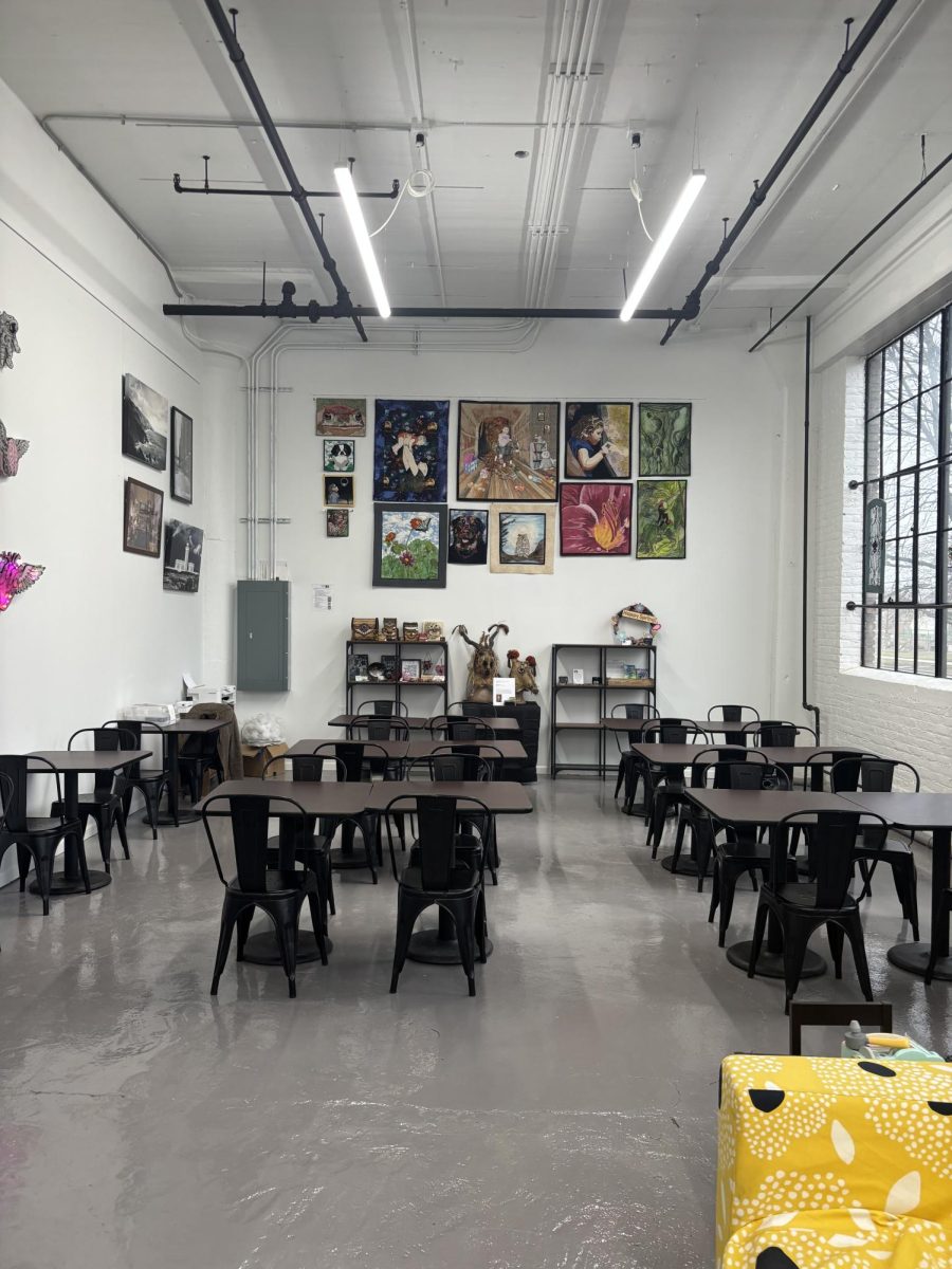 The inside of Flour and Bean, full of artwork from the artists in the Screw Factory.