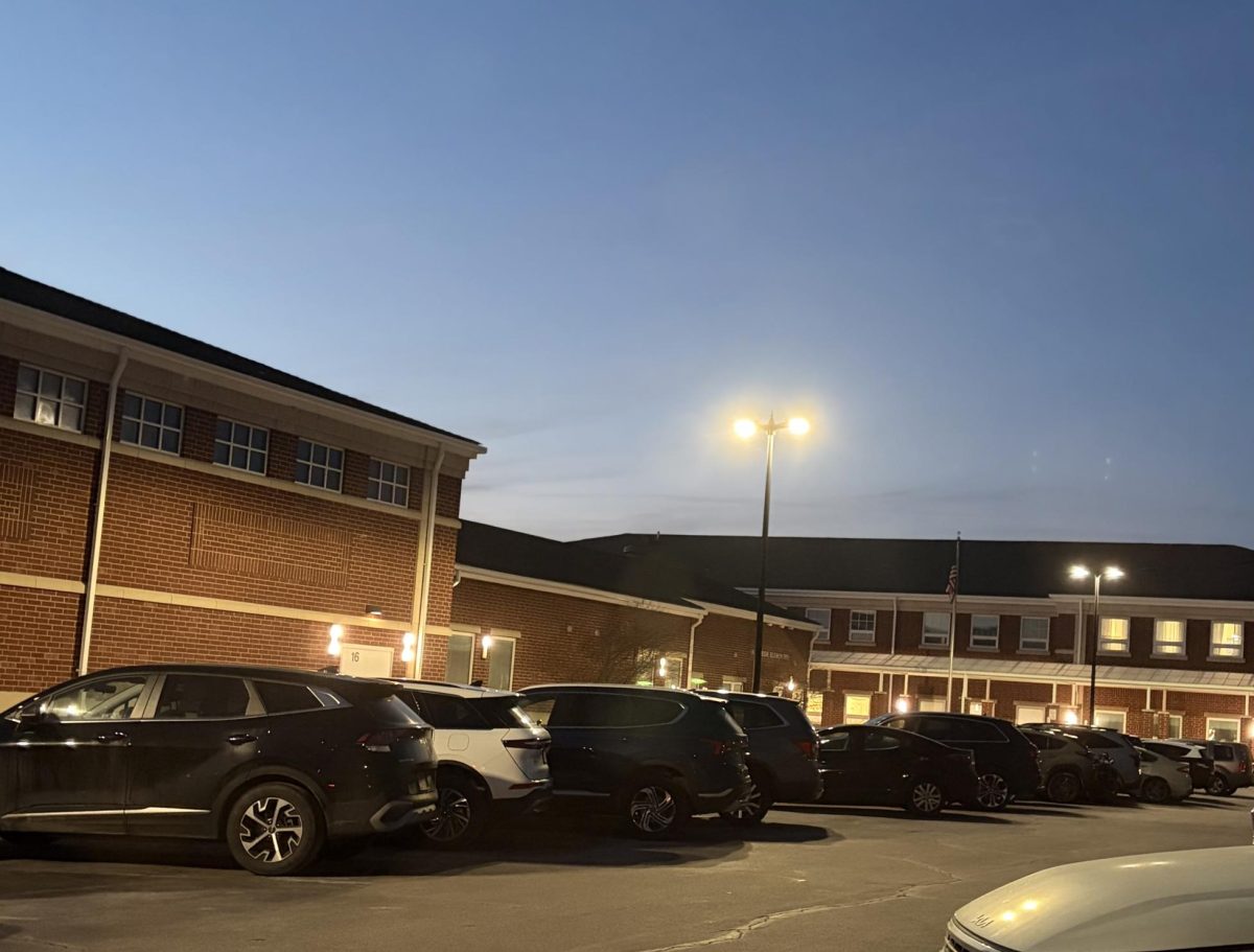 Harrison Elementary, location of the meeting, with attendees' cars parked.