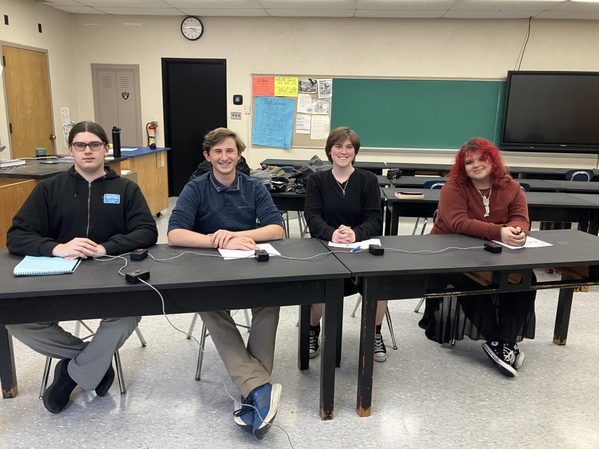 Lakewood's Academic Challenge team (middle) competes against other students with a buzzer system.