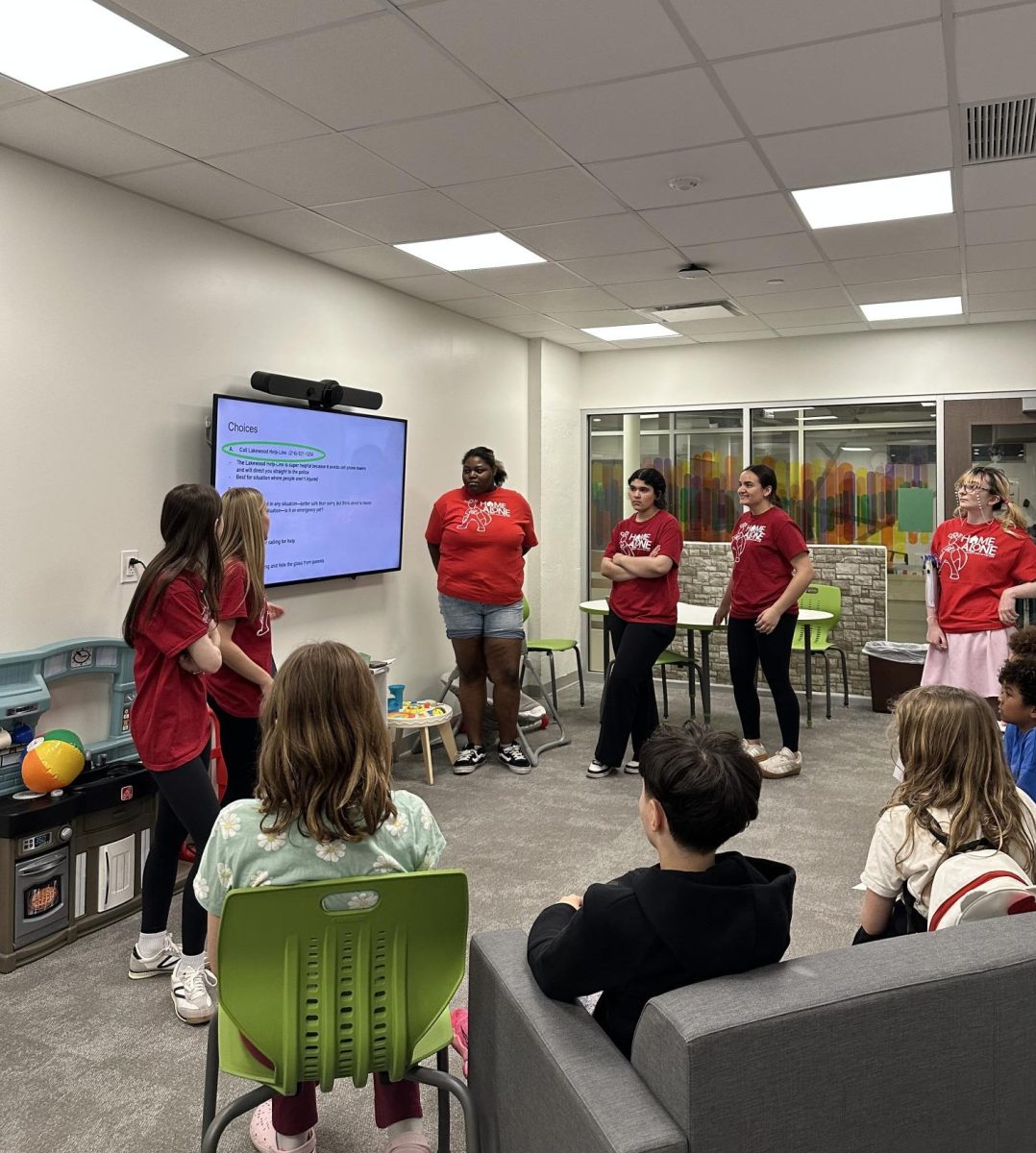 The emergencies group giving their presentation to the kids.
