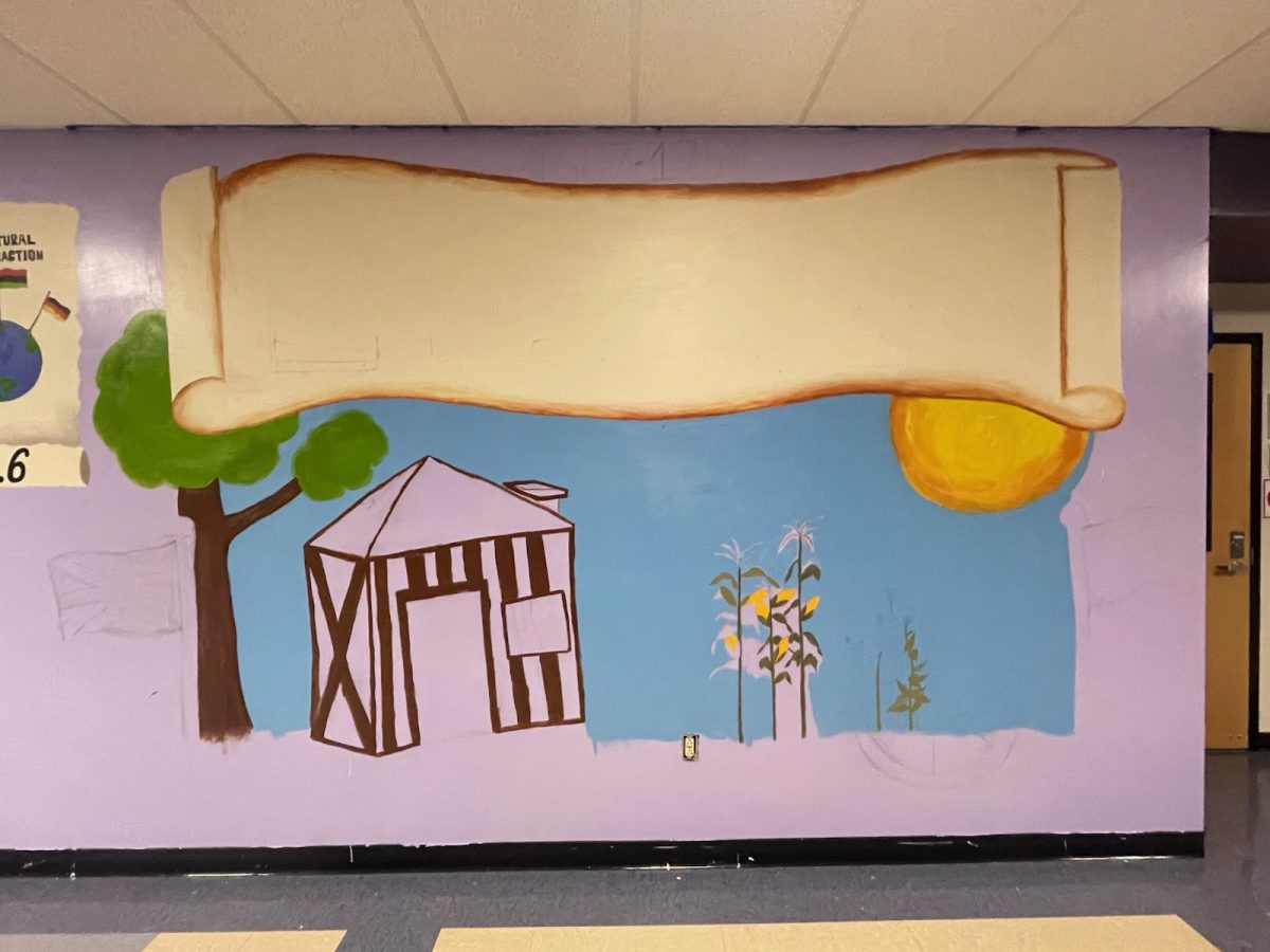The start of the new addition to the wall mural in the hallway.