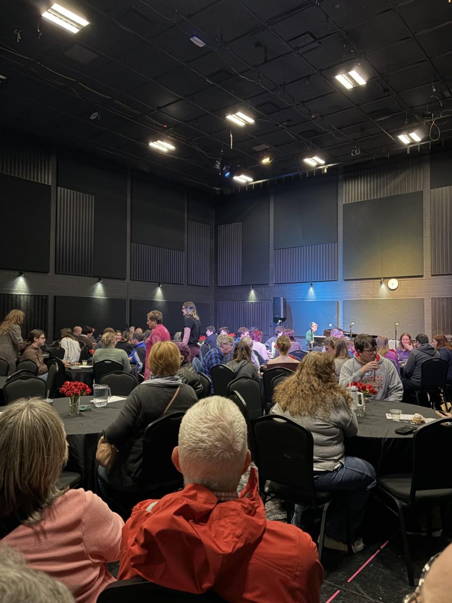 Attendees gather at their tables before the concert begins.